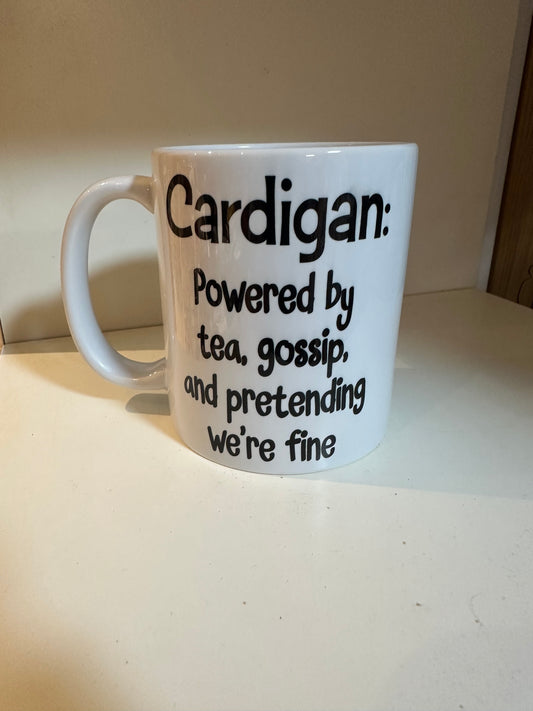 Cardigan: Powered by Tea, Gossip, and Pretending We’re Fine — Ceramic Mug